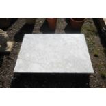 A marble table top measuring approx. 48" x 34"
