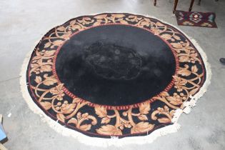 An approx. 7' x 8' circular patterned rug