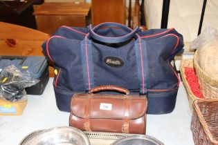 A Henselit lawn bowls bag containing four bowling