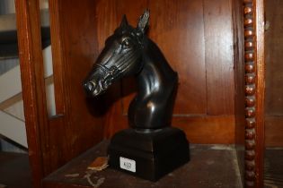 A bronzed model of a horses head