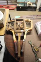 Five vintage tennis rackets with wooden clamps