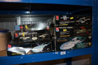 A collection of boxed Star Trek and Alien models
