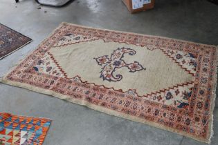 An approx. 6'8" x 4'2" patterned rug