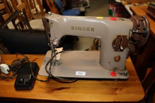 A Singer sewing machine, sold as collectors item