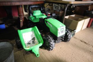 A child's pedal Viking garden tractor with trailer