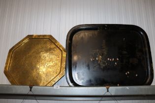 An Oriental black lacquered tray and an Eastern br