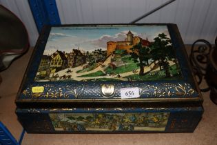 A vintage large German tin and a graduated pair of