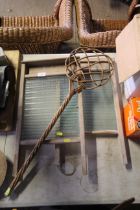 Two vintage washboards and a carpet beater