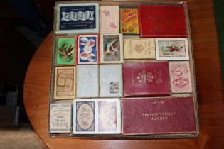 A tray of vintage playing cards and card games
