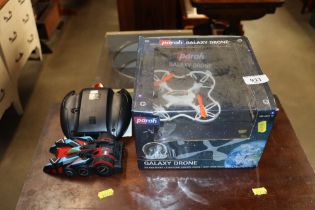A Galaxy drone and a remote controlled car
