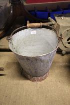 A galvanised pail with swing handle (107)