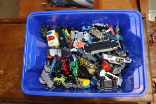 A box of various diecast and other toy vehicles, a