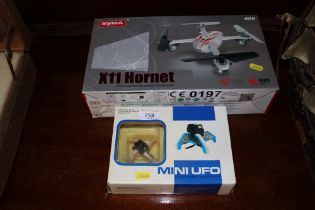 A Syma X11 Hornet drone and a mini UFO "The Worlds