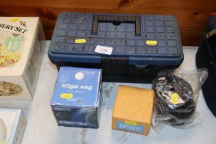 A collection of fly fishing reels and a box of fis