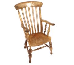 A Victorian elm seated slat back kitchen elbow chair