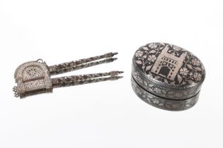 A pair of finely decorated steel and silvered Bidri ware Indo-Persian betel nut cutters, 16cm