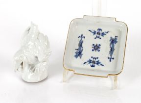 A Meissen blanc de chine study of a bird eating fruit; and a small Meissen shallow dish with