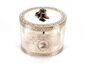 A George III silver tea caddy, by George Smith, of oval form the hinged lid surmounted by a