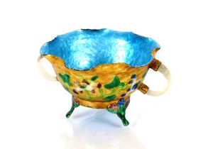 A Chinese brightly enamelled footed bowl, applied with two finely carved white jade side handles