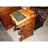 A Victorian walnut Davenport writing desk, with hinged stationery compartment, lift up leather inset