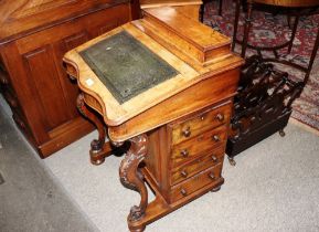 A Victorian walnut Davenport writing desk, with hinged stationery compartment, lift up leather inset