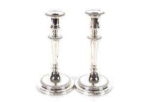 A pair of late 20th Century silver candlesticks by Mappin & Webb, with Campana shaped sconces and