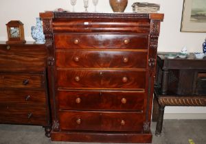 A Victorian mahogany Scottish chest, having blind frieze drawer with five graduated drawers below,