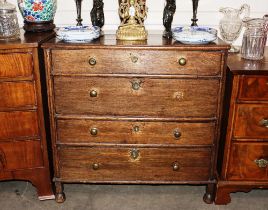 An antique oak chest of four long drawers, raised on bun feet, 85cm wide AF