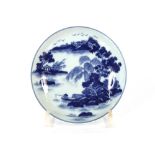 A pair of blue and white Chinese porcelain saucer dishes, painted with a landscape, the reverse with