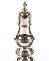 A late 1970's silver sugar shaker of baluster form, surmounted by a knop finial and raised spread