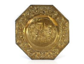 A pair of decorative octagonal brass plaques, depicting interior Inn scenes, worn in parts, 63cm