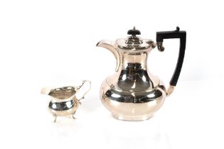 A plated coffee pot of baluster shape, having black wood handle and lift and a George V silver cream
