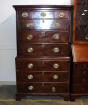 A Georgian mahogany tall boy chest, the upper section fitted three short and three long drawers