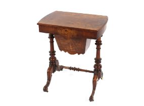 A Victorian burr walnut and inlaid sewing  table, the hinged lid opening to reveal compartments