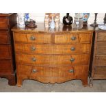 A 19th Century  mahogany bow front chest of two short and three long drawers, raised on a shaped