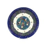 A late 19th Century Japanese blue and white cloisonné style circular porcelain dish, decorated