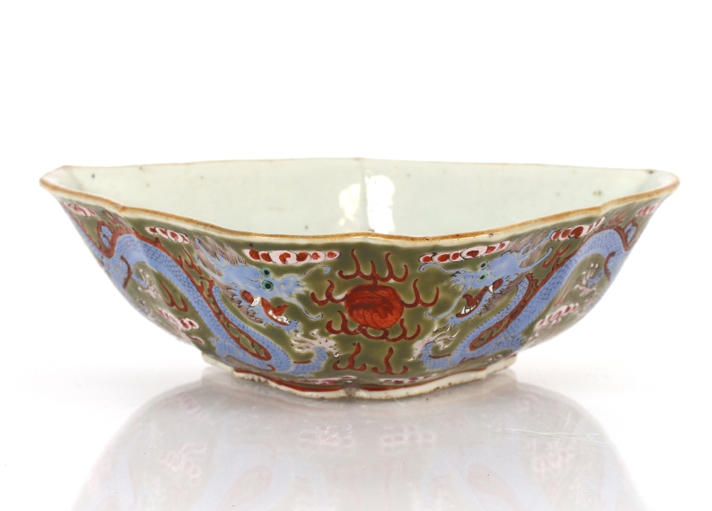 An unusual 19th Century Chinese porcelain bat shaped bowl, painted with five clawed dragons, flaming