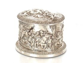 A white metal hinged box possibly by Asprey & Co. richly embossed with an allegorical scene with