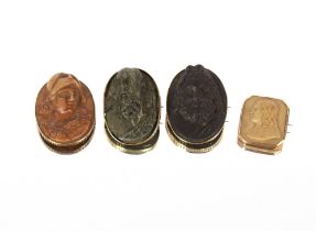 Four 18th Century classical Italian lava brooches, set in yellow metal mounts