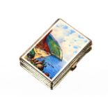 A silver engine turned and enamel cigarette case, decorated with a coastal scene, 8cm x 5.5cm