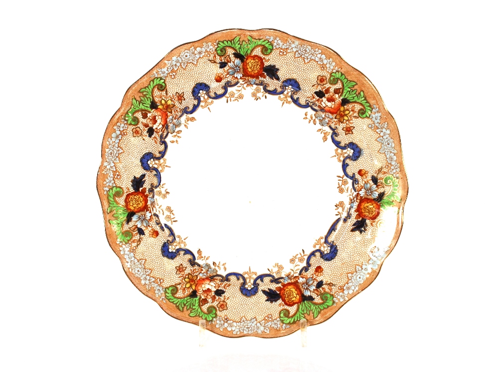 An extensive late Victorian dinner service by John Maddock & Sons, having foliate scroll