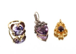 A .585 gold and amethyst coloured stone ring; a Victorian gold and garnet pendant; and an amethyst