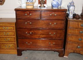 A Georgian mahogany chest of two short and three long drawers, raised on bracket supports, 103cm