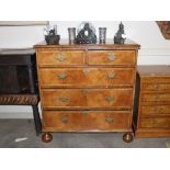 An 18th Century walnut chest, fitted two short and three long drawers, raised on bun feet, 100cm