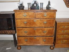 An 18th Century walnut chest, fitted two short and three long drawers, raised on bun feet, 100cm
