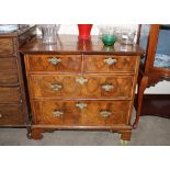 An 18th Century walnut and herringbone banded chest of small proportions, fitted two short and