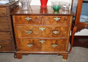 An 18th Century walnut and herringbone banded chest of small proportions, fitted two short and