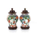 A pair of Chinese baluster vases, decorated figures, foliage and clouds, approx. 38cm high with