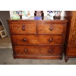 A Victorian mahogany chest fitted two short and two long drawers, raised on bun feet, 122cm wide