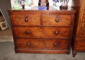 A Victorian mahogany chest fitted two short and two long drawers, raised on bun feet, 122cm wide